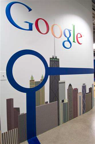 Google's Logo and Chicago's Blue Line over the Skyline